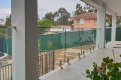 Frameless glass panel fence for balcony with stainless steel fittings