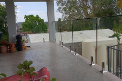 Frameless glass panel fence for balcony with stainless steel fittings